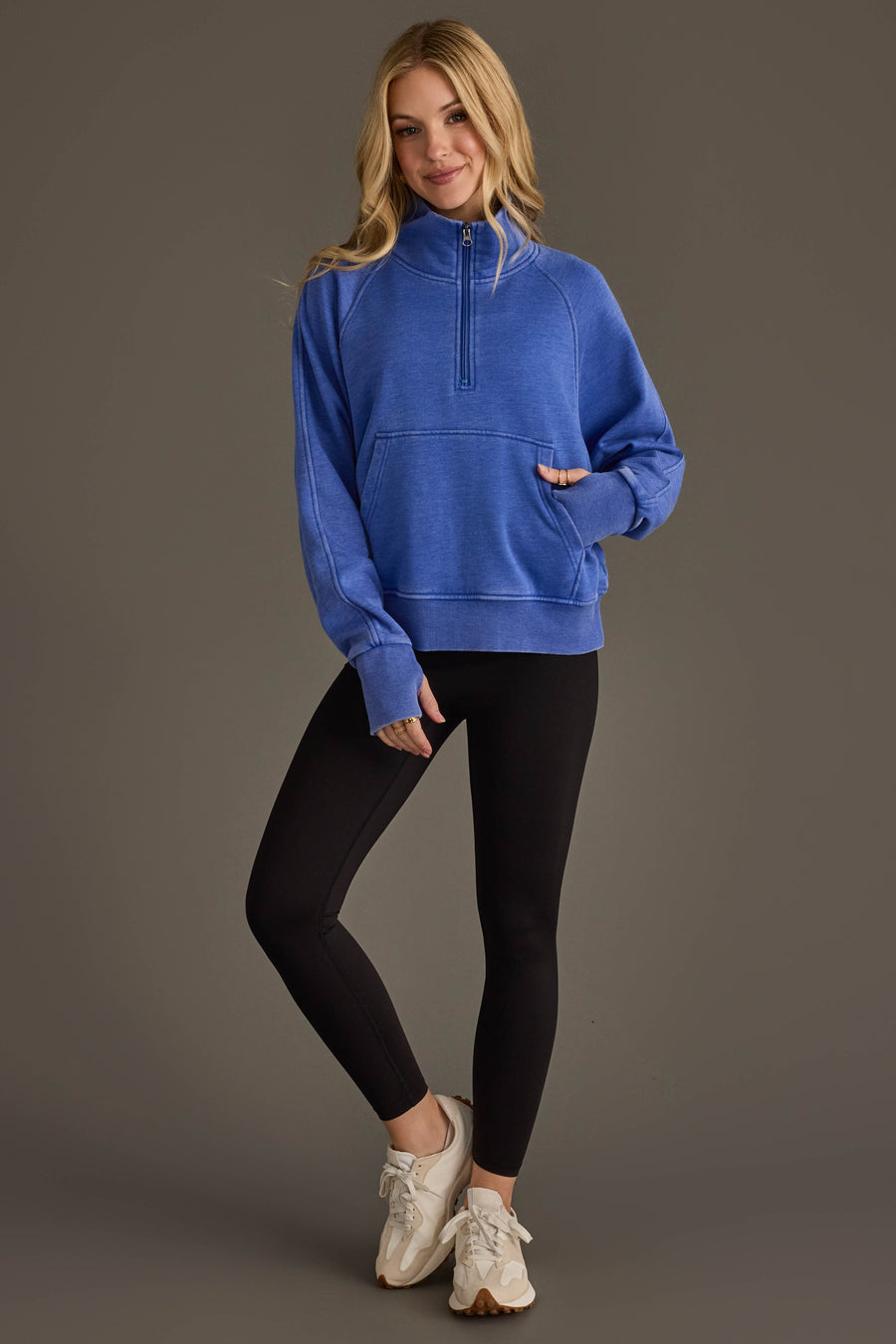 Full-length view of Panache Apparel’s royal blue quarter zip sweatshirt.
