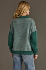 Back view of Panache Apparel’s teal mixed media quarter zip sweatshirt.