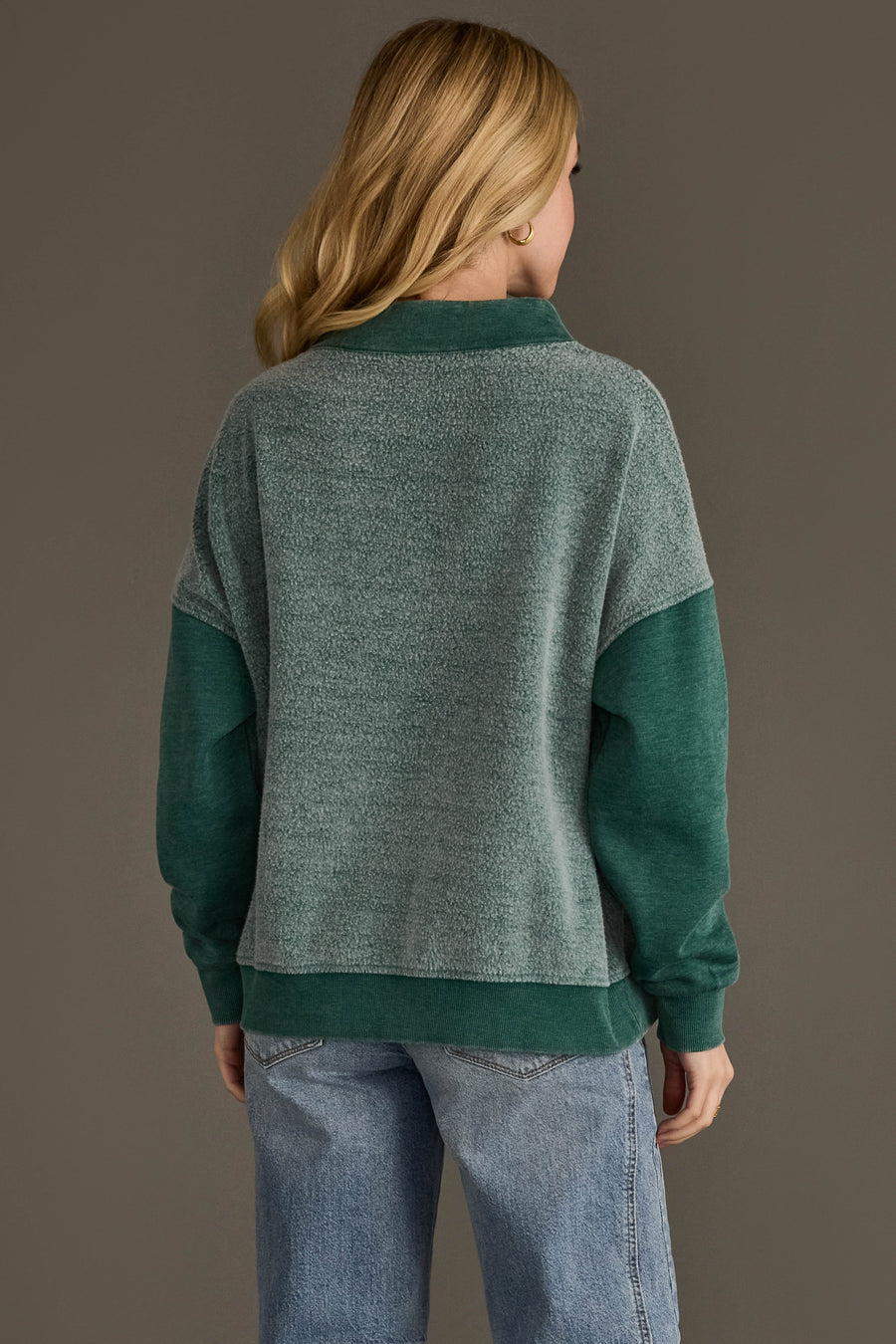 Back view of Panache Apparel’s teal mixed media quarter zip sweatshirt.