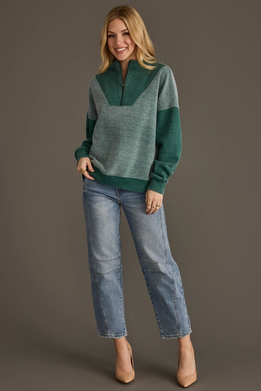 Full-length view of Panache Apparel’s teal mixed media quarter zip sweatshirt.