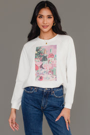 A woman wearing a white Panache Apparel Collection Christmas Cocktails Scene Sweatshirt featuring a graphic print of Christmas cocktails, a bottle of champagne, and wrapped gifts.