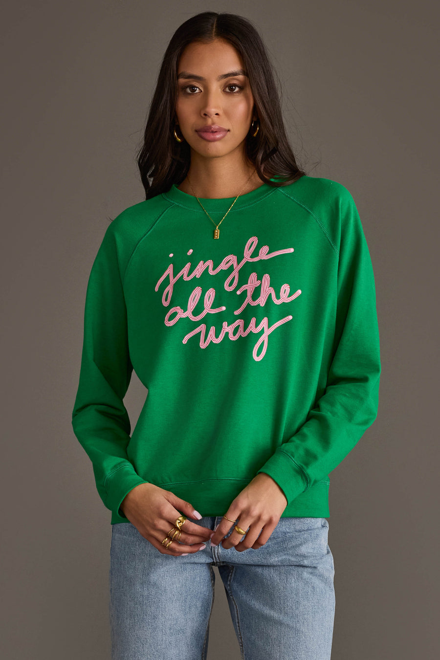 A bright green Panache Apparel Collection Green Jingle All The Way Sweatshirt featuring the words jingle all the way written in cursive pink script across the chest.