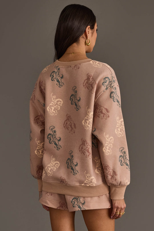 Back view of woman wearing Panache Apparel’s dusty rose western print sweatshirt and lounge shorts set.