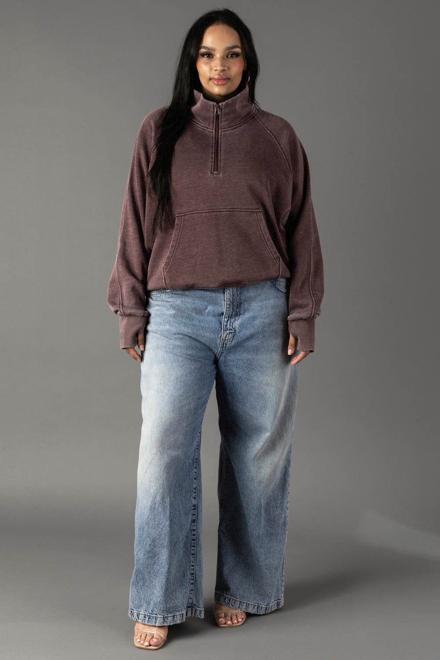 Full-length view of plus-size woman wearing Panache Apparel’s reddish-brown quarter zip sweatshirt.
