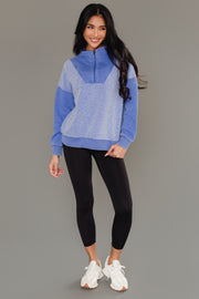 Full-length view of Panache Apparel’s royal blue mixed media quarter zip sweatshirt.