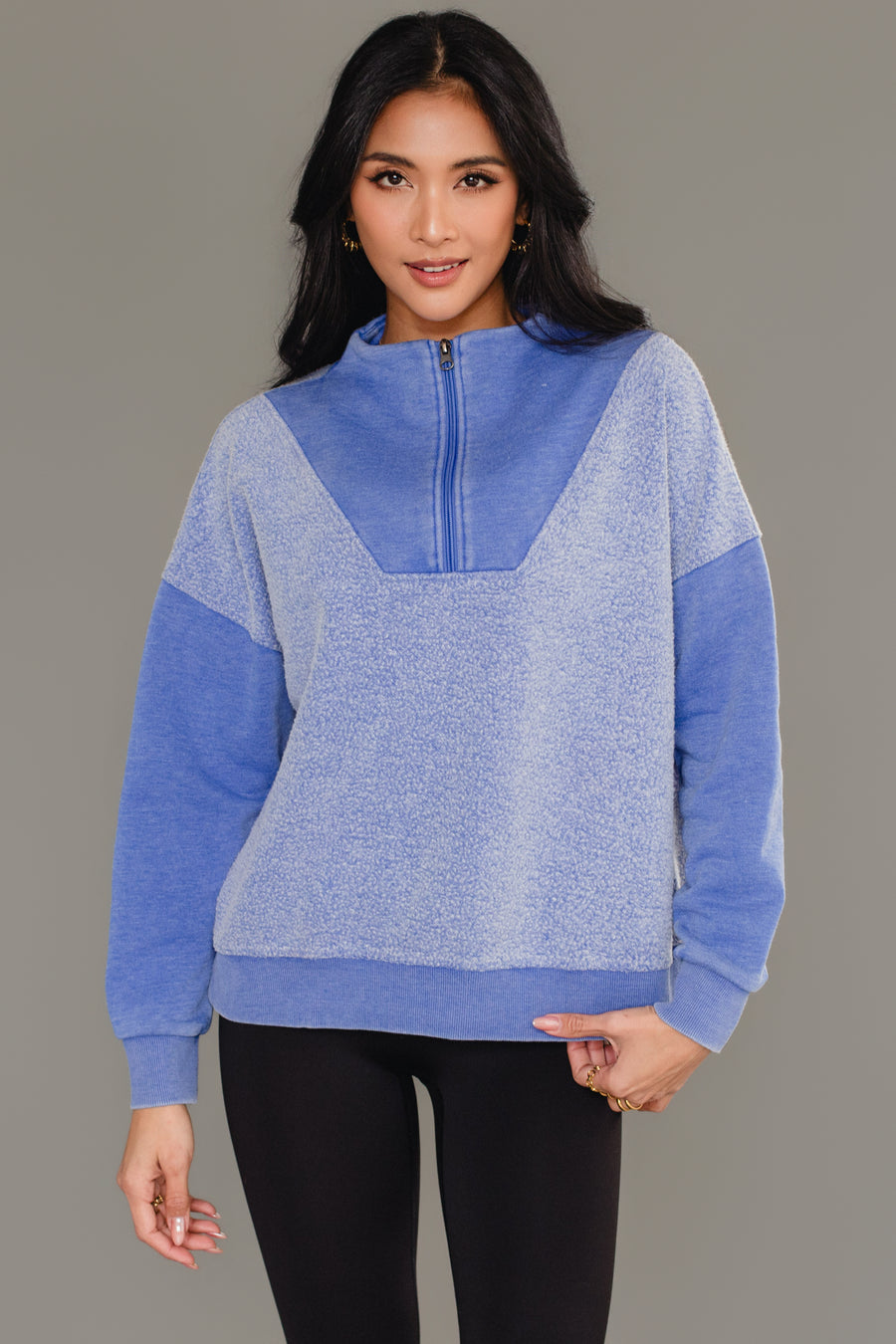 Woman wearing Panache Apparel’s royal blue mixed media quarter zip sweatshirt.
