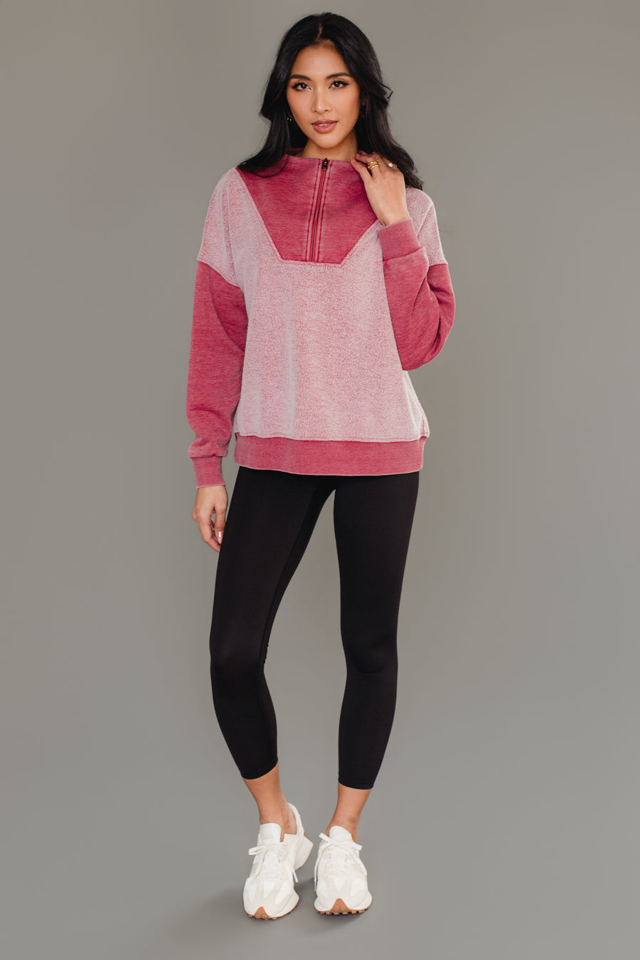 Full-length view of woman wearing Panache Apparel’s burgundy mixed media quarter zip sweatshirt.