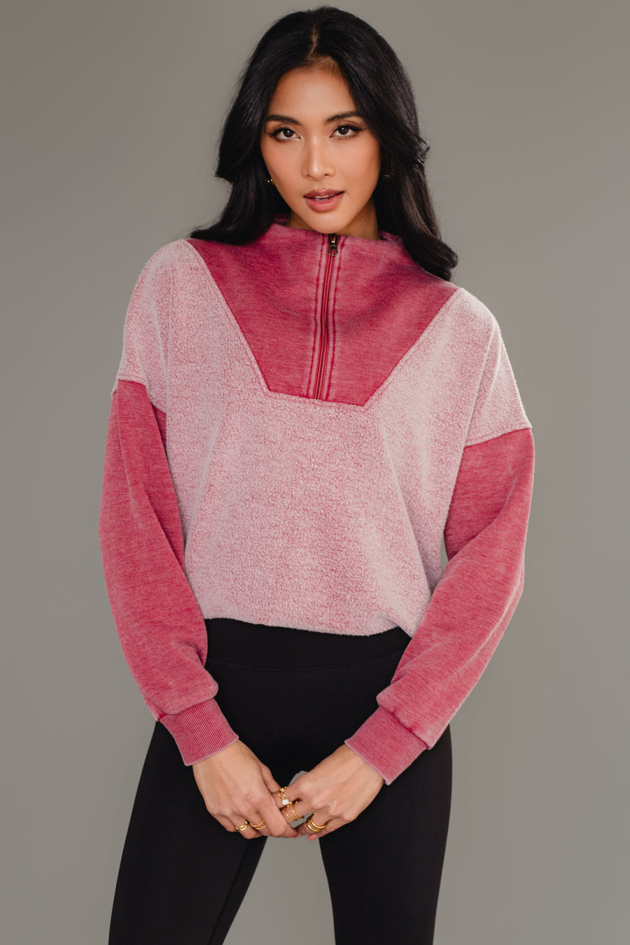 Woman wearing Panache Apparel’s burgundy mixed media quarter zip sweatshirt.