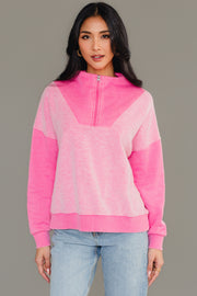 Front view of woman wearing Panache Apparel’s pink mixed media quarter zip sweatshirt.