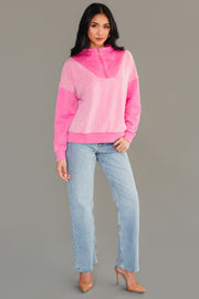 Full-length view of woman wearing Panache Apparel’s pink mixed media quarter zip sweatshirt.