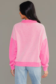 Back view of woman wearing Panache Apparel’s pink mixed media quarter zip sweatshirt.