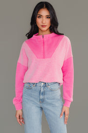 Woman wearing Panache Apparel’s pink mixed media quarter zip sweatshirt.