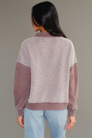 Back view of woman wearing Panache Apparel’s brown mixed media quarter zip sweatshirt.