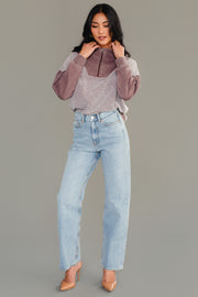 Full-length view of woman wearing Panache Apparel’s brown mixed media quarter zip sweatshirt.