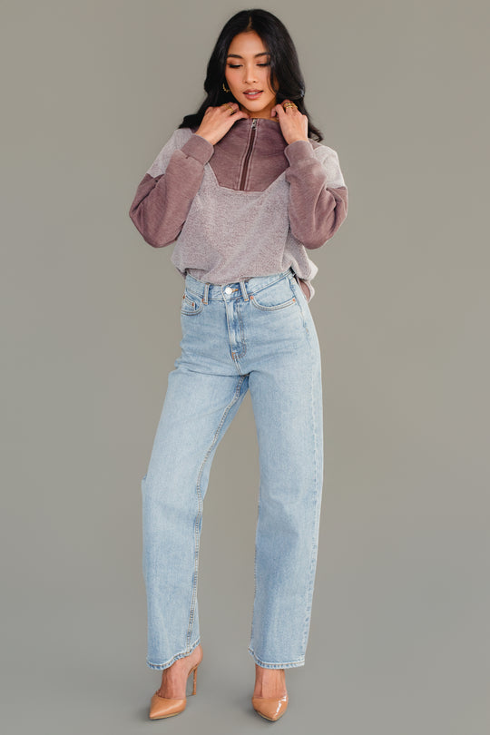 Full-length view of woman wearing Panache Apparel’s brown mixed media quarter zip sweatshirt.