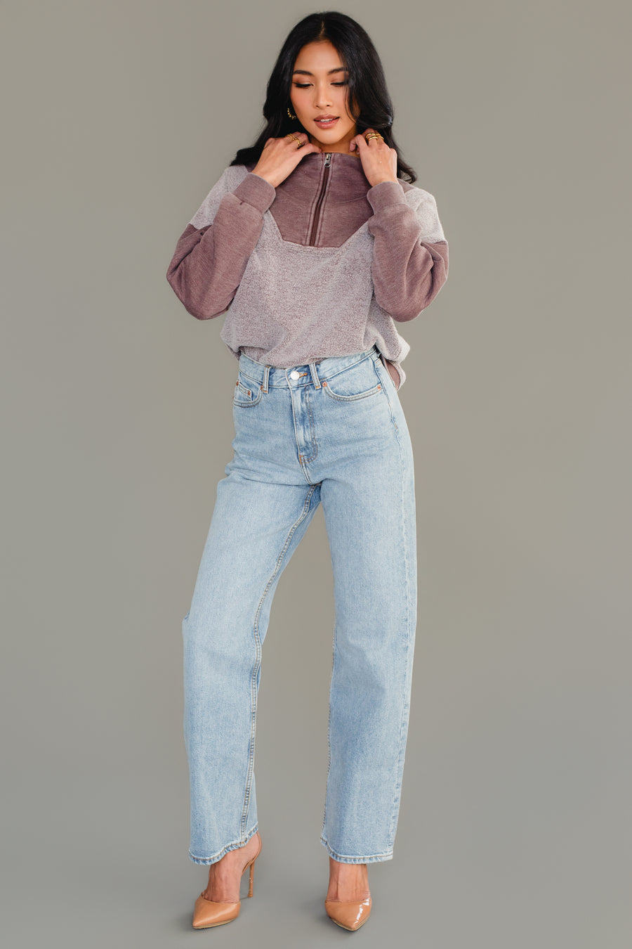 Full-length view of woman wearing Panache Apparel’s brown mixed media quarter zip sweatshirt.