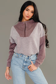 Woman wearing Panache Apparel’s brown mixed media quarter zip sweatshirt.