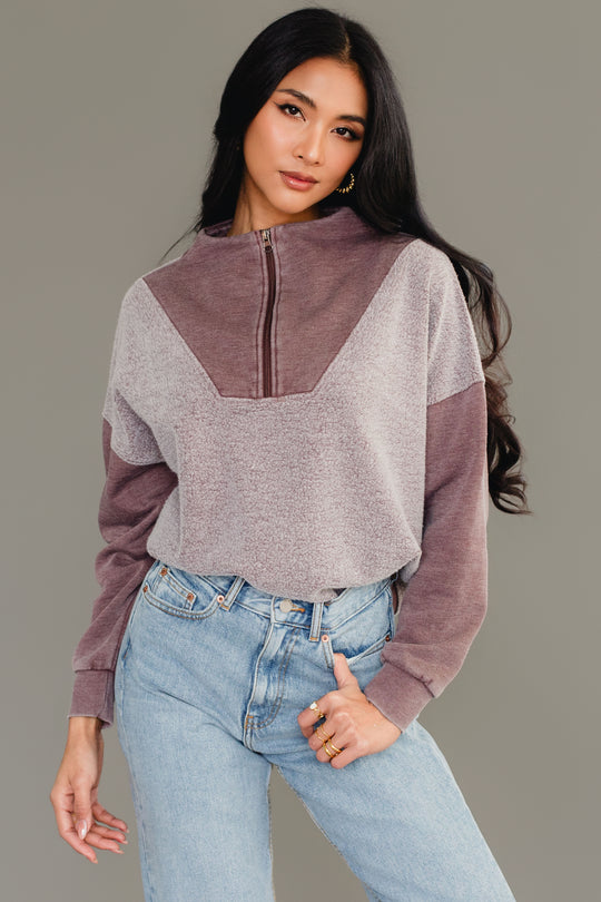 Woman wearing Panache Apparel’s brown mixed media quarter zip sweatshirt.
