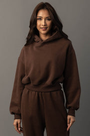 Front studio view of Panache Apparel’s brown pullover hoodie styled with matching jogger sweatpants.