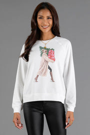 White Girl Carrying Presents & Tree Sweatshirt by Panache Apparel Collection featuring a graphic of a woman in a fur coat carrying a Christmas tree and a stack of presents.