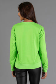 Back view of a person wearing a bright green, lightweight Bright Green Merry Sweatshirt.