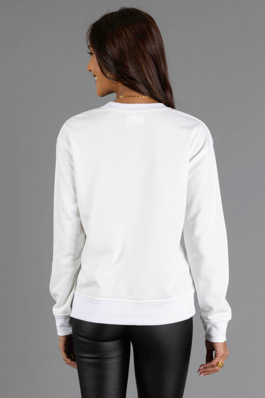 A person seen from the back wearing a white long-sleeved White Joyful Sweatshirt from the Panache Apparel Collection.