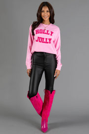 A person wearing a Pink Holly Jolly Sweatshirt by Panache Apparel Collection, black pants, and tall pink boots.