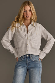 A woman with long blonde hair wears the Panache Apparel Collection White & Light Gray Plaid Button Up and blue jeans, standing with hands on her hips against a simple gray background.