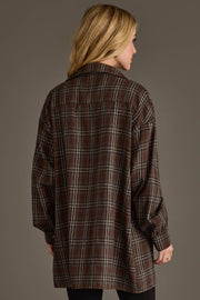 A person with long blonde hair, seen from the back, wears the Panache Apparel Collection Brown, Blue, Cream & Black Boyfriend Fit Plaid Button Up against a neutral background.