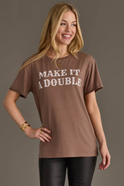 Woman wearing Panache Apparel’s brown Make It A Double western graphic tee.