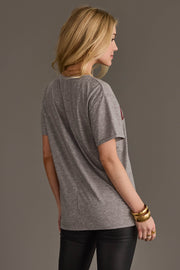 Back view of woman wearing Panache Apparel’s gray Cowboys & Beer western graphic tee.