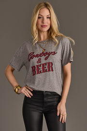 Woman wearing Panache Apparel’s gray Cowboys & Beer western graphic tee.