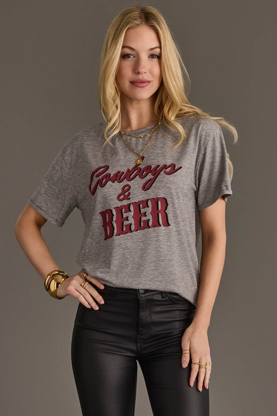 Woman wearing Panache Apparel’s gray Cowboys & Beer western graphic tee.