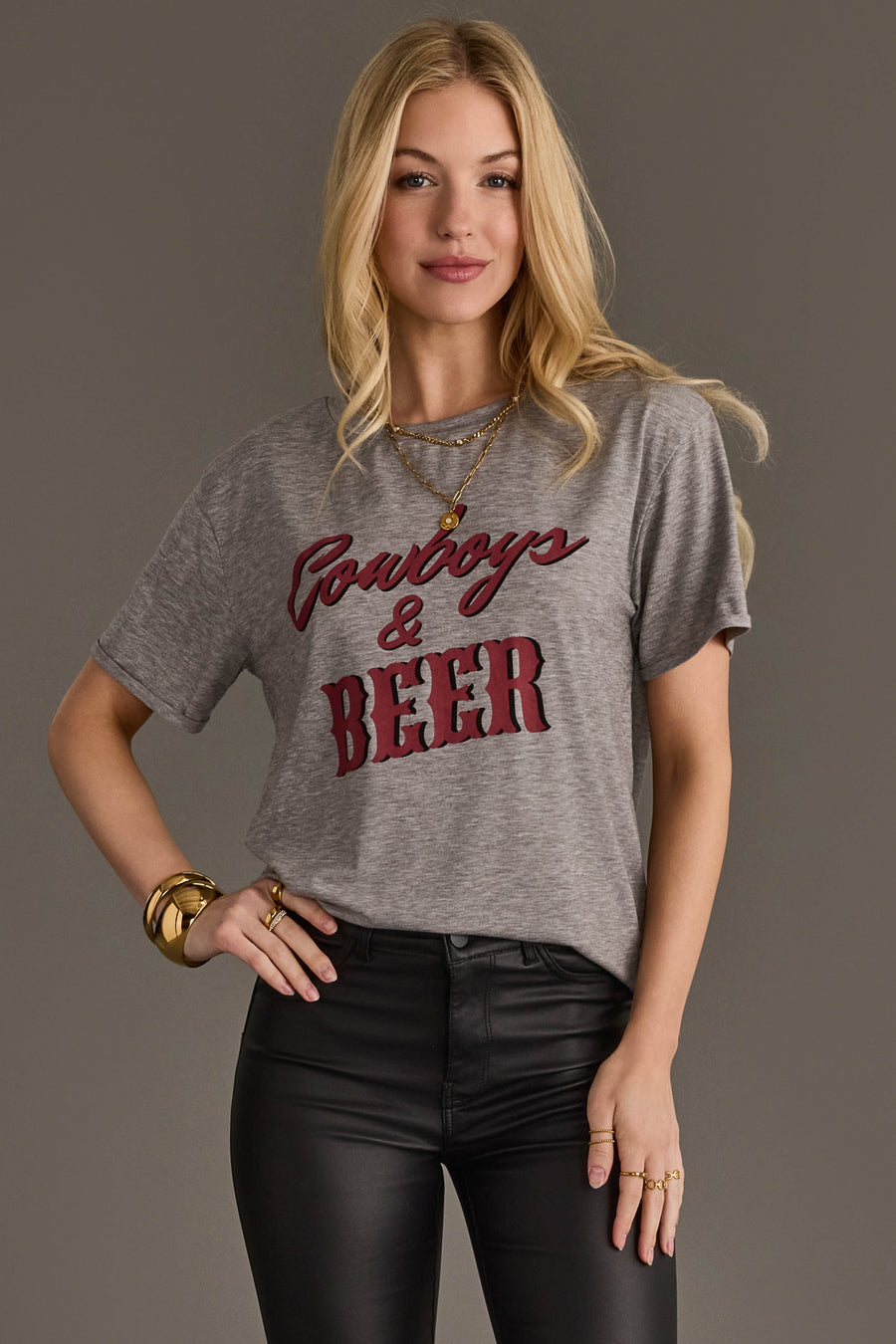 Woman wearing Panache Apparel’s gray Cowboys & Beer western graphic tee.