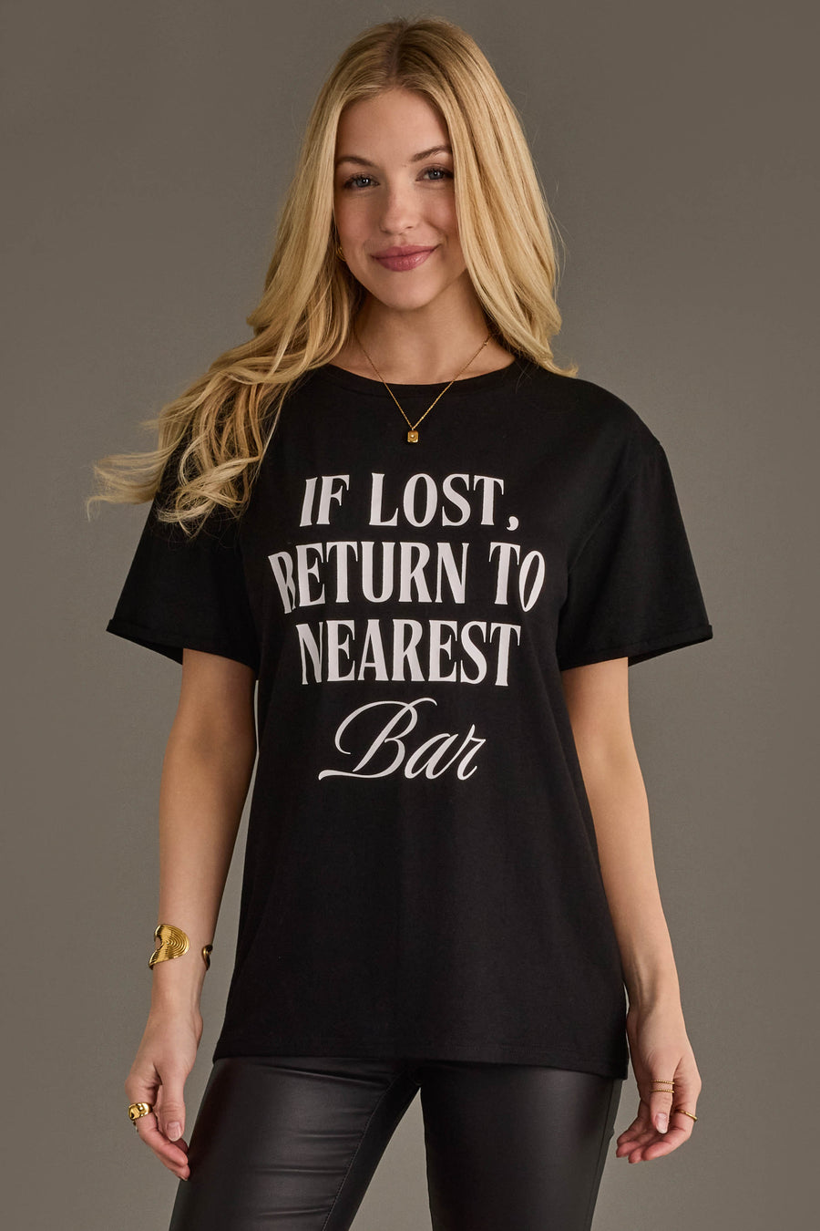 Woman wearing Panache Apparel’s black If Lost, Return To Nearest Bar western graphic tee.