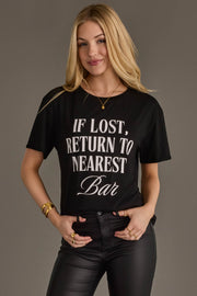 Woman wearing Panache Apparel’s black If Lost, Return To Nearest Bar graphic tee.