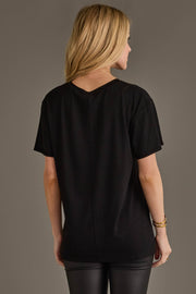 Back view of woman wearing Panache Apparel’s black Jesus Saves I Spend graphic tee.