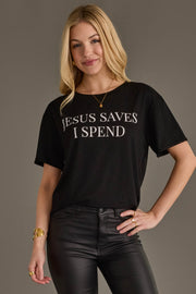Woman wearing Panache Apparel’s black Jesus Saves I Spend graphic tee.