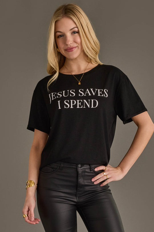 Woman wearing Panache Apparel’s black Jesus Saves I Spend graphic tee.