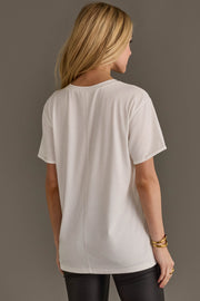 Back view of woman wearing Panache Apparel’s white Wild Like The West western graphic tee.