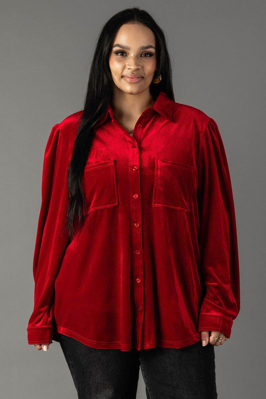 A long-sleeved red velvet button-up shirt from the Panache Apparel Collection featuring a collar, two chest pockets, and button-up detailing.