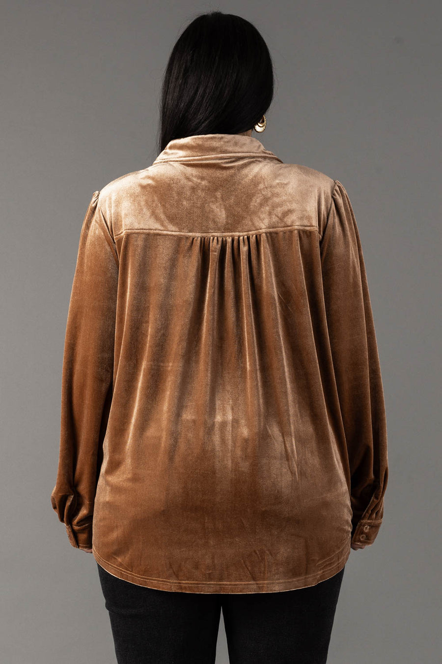 Back view of the Tan Velvet Button Up, a tan long-sleeve shirt with a collared neckline and gathered detailing at the back yoke in a relaxed fit.