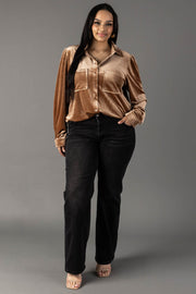A woman wears a Panache Apparel Collection Tan Velvet Button Up long-sleeved shirt with two chest pockets and black straight-leg jeans.