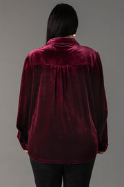 Back view of a person wearing a Maroon Velvet Button Up shirt in maroon velvet with a pleated back yoke.
