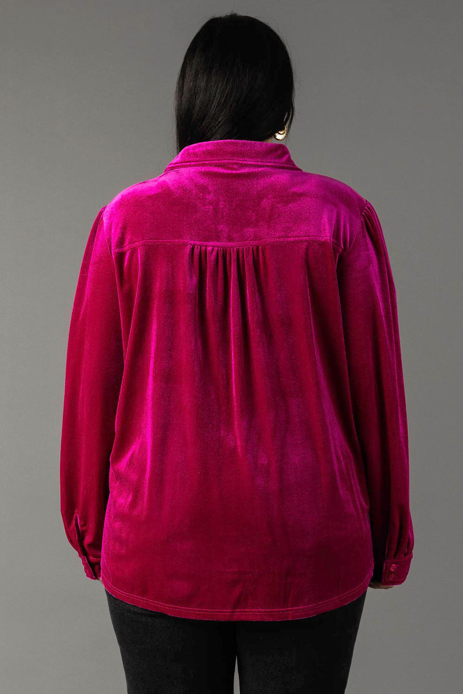 Back view of the Fuchsia Velvet Button Up in fuchsia velvet, featuring a pleated back yoke.