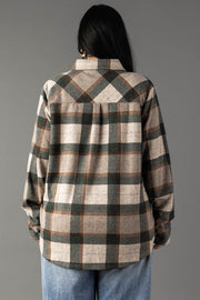 A person with long dark hair, wearing the Panache Apparel Collection Tan, Dark Green & Rust Plaid Button Up and blue jeans, is standing with their back to the camera against a plain gray background.