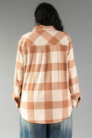 A person with long dark hair, shown from the back against a plain gray background, is wearing the Panache Apparel Collection Cream & Rust Plaid Button Up with blue jeans.