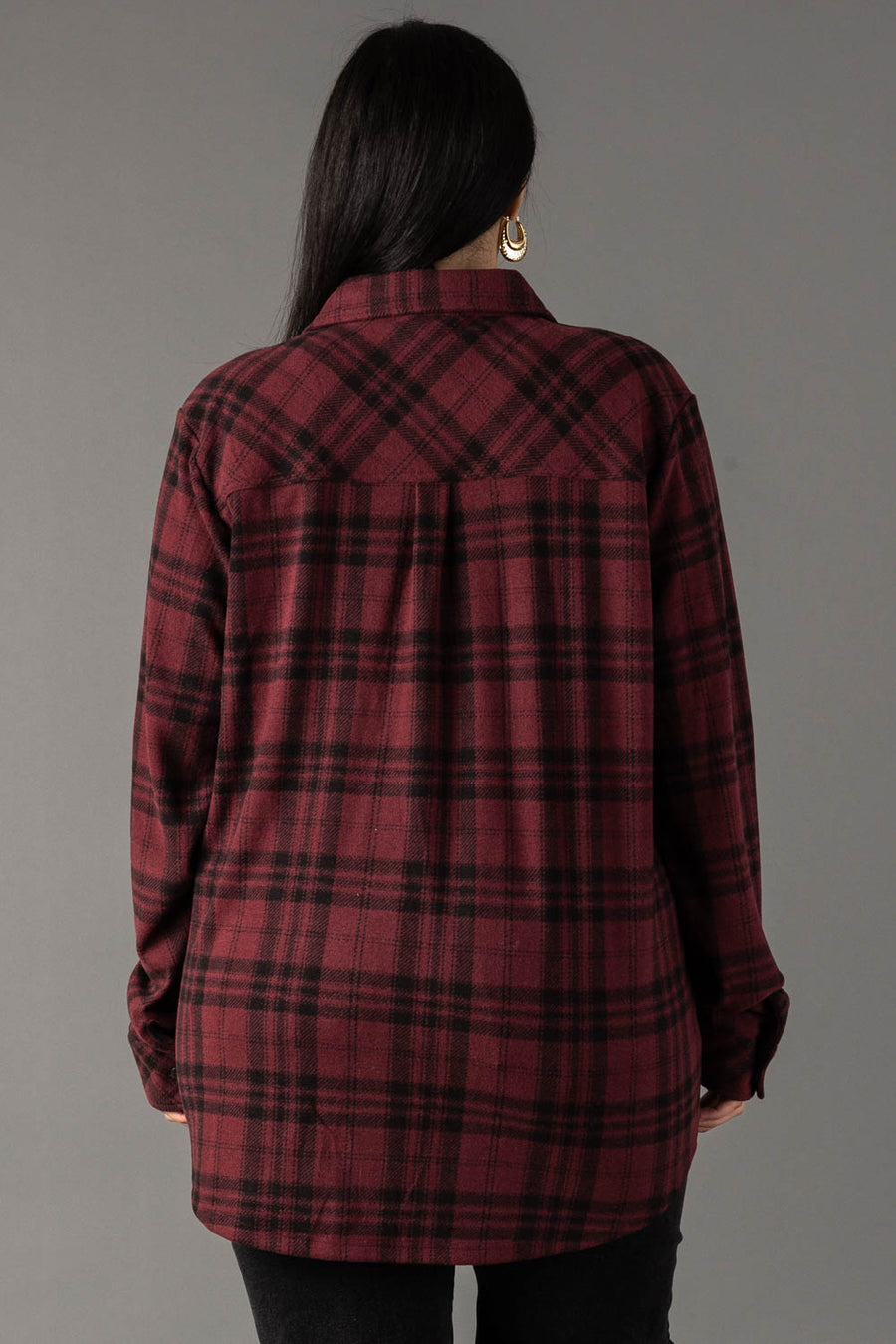 A person with long dark hair is seen from behind, wearing the Panache Apparel Collection Maroon & Black Plaid Button Up against a plain gray background.