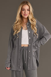 Woman wearing a gray washed soft button up unbuttoned over a white cropped top and matching sweatpants from the Panache Apparel Collection.