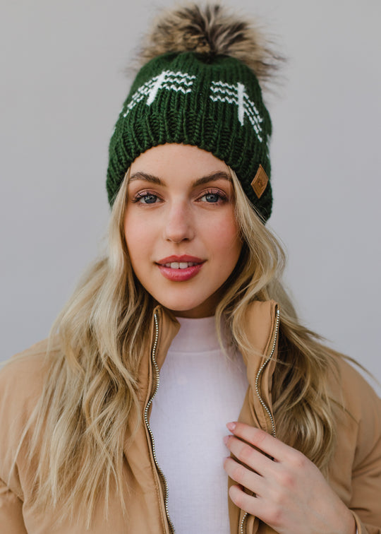 green hat with white trees